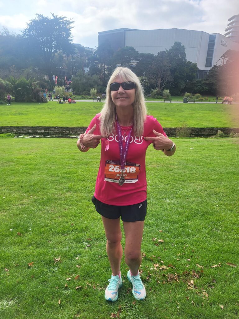 Lady showing off her medal
